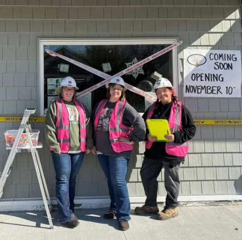 Library workers in front of library